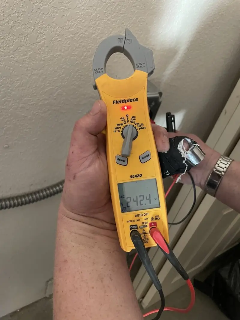 Voltage testing with clamp meter during Electrical Installation Services in St. Matthews